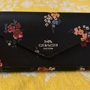 Coach Black and Red Wallet with Sophisticated Design